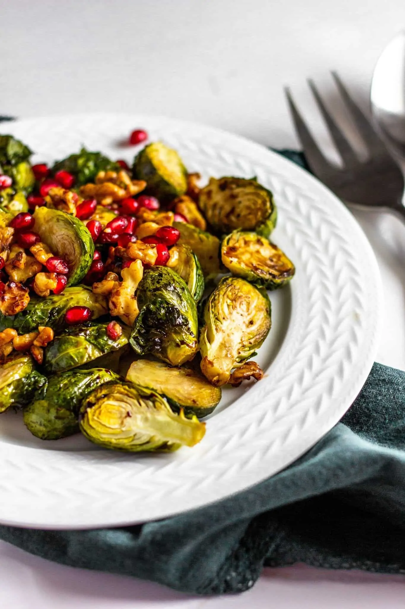 Roasted Brussels Sprouts with Pomegranates and Toasted Walnuts #pomegranate #brusselssprouts #tararochfordnutrition